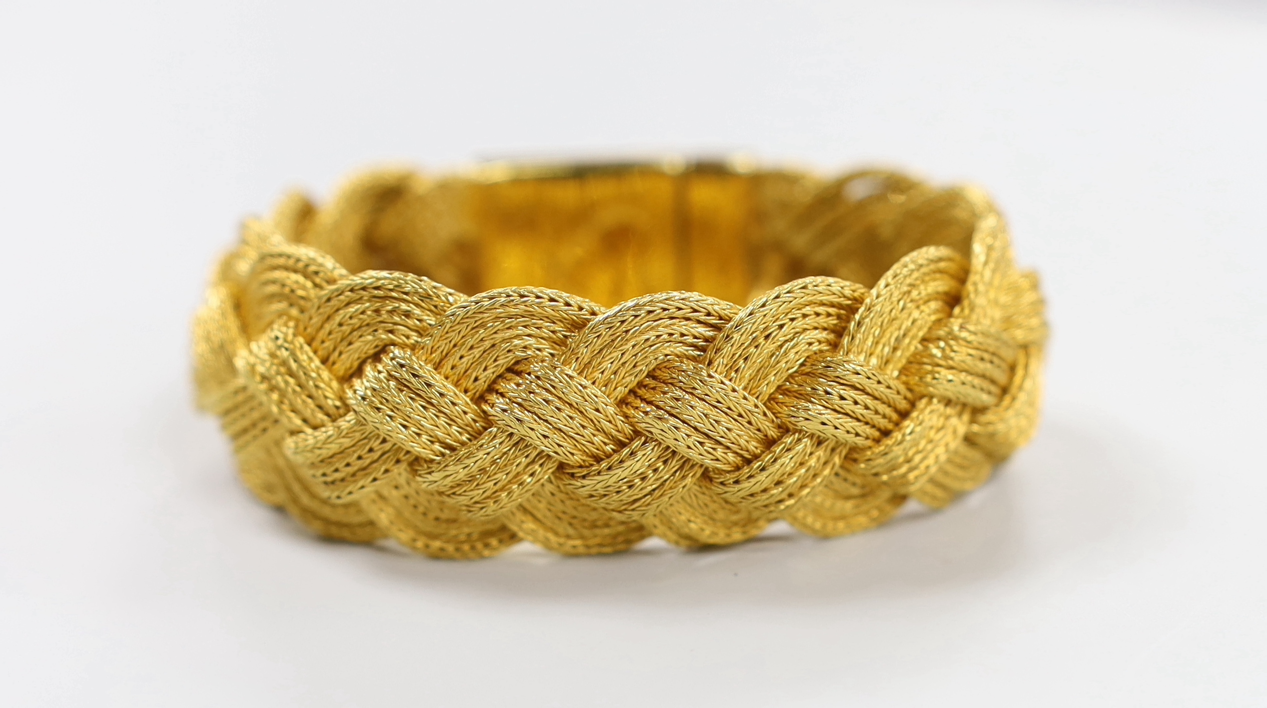 A 20th century Thai high grade yellow metal interwoven bracelet, 17.5cm, 128.3 grams.
